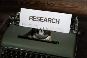 typewriter and paper says research